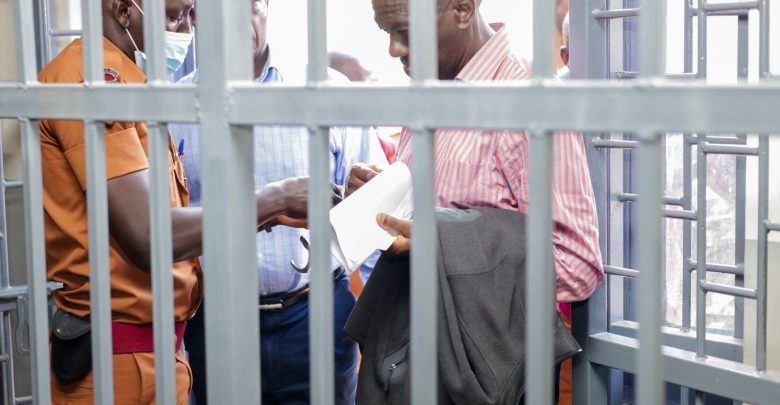 Dr. Kizza Besigye and his Co-accused being unhand-cuffed on Tuesday January 14, 2025 at Makindye General Court Martial.