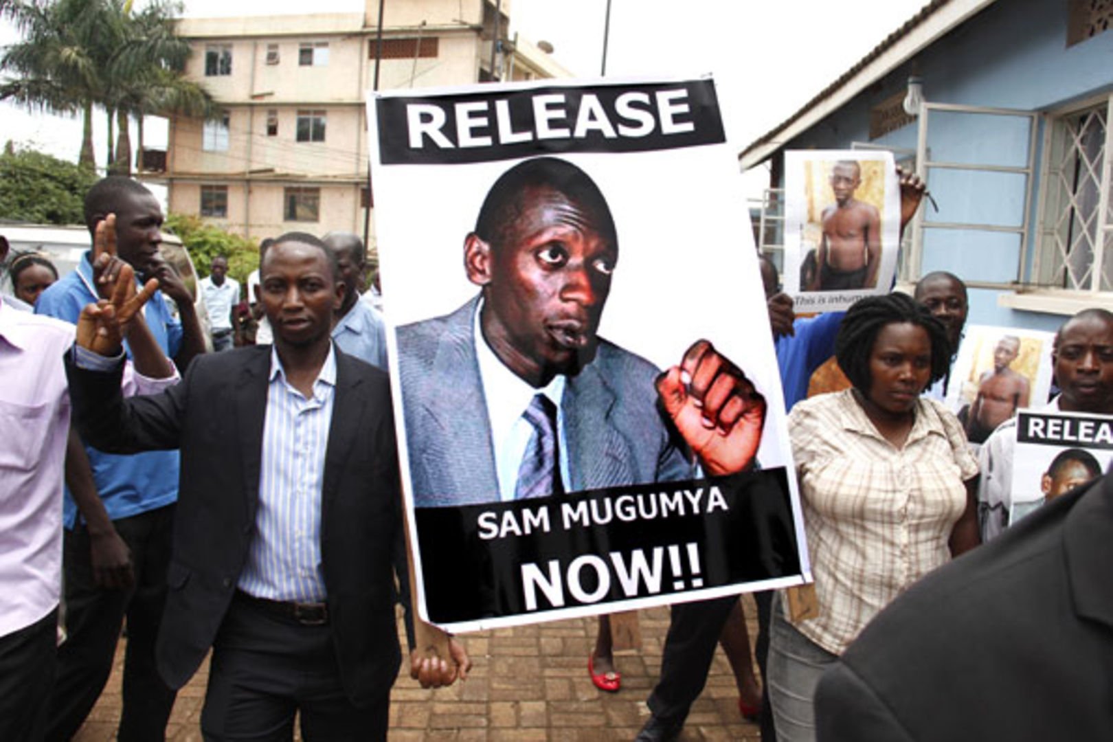 Friends of Sam Mugumya displaying a campaign flier demanding for his release in November 2024. Daily Monitor Courtesy Photo.