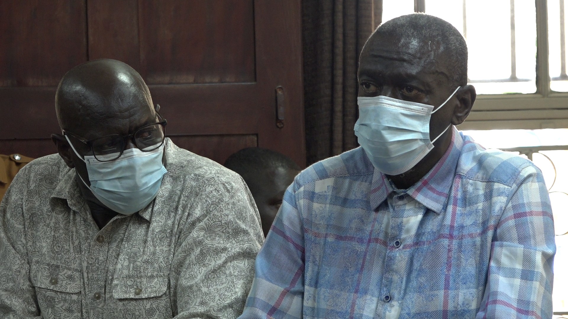 Col. Kizza Besigye and Hajji Obeid Lutale at High Court for their Mandatory Bail Application Hearing on August 06, 2025 in Kampala. Photo by Mukose Arnold Anthony.